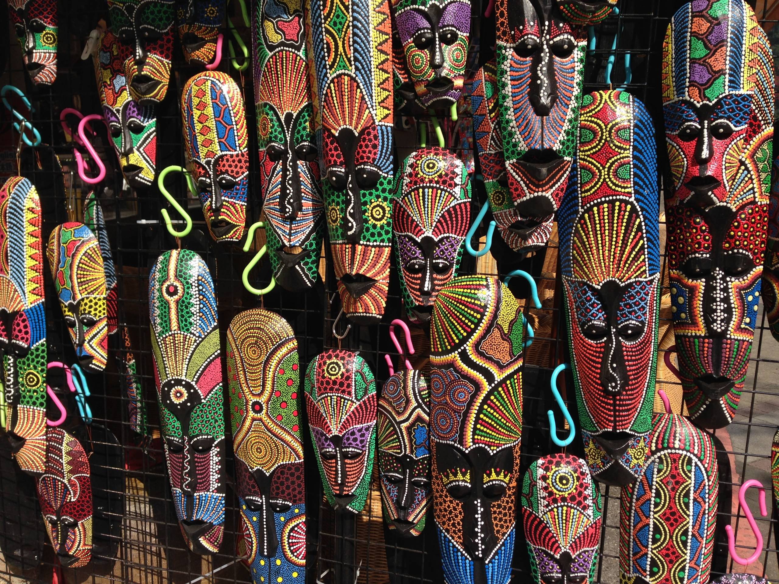 assorted-colourful-long-carved-wood-masks-to-signify-imposter-syndrome